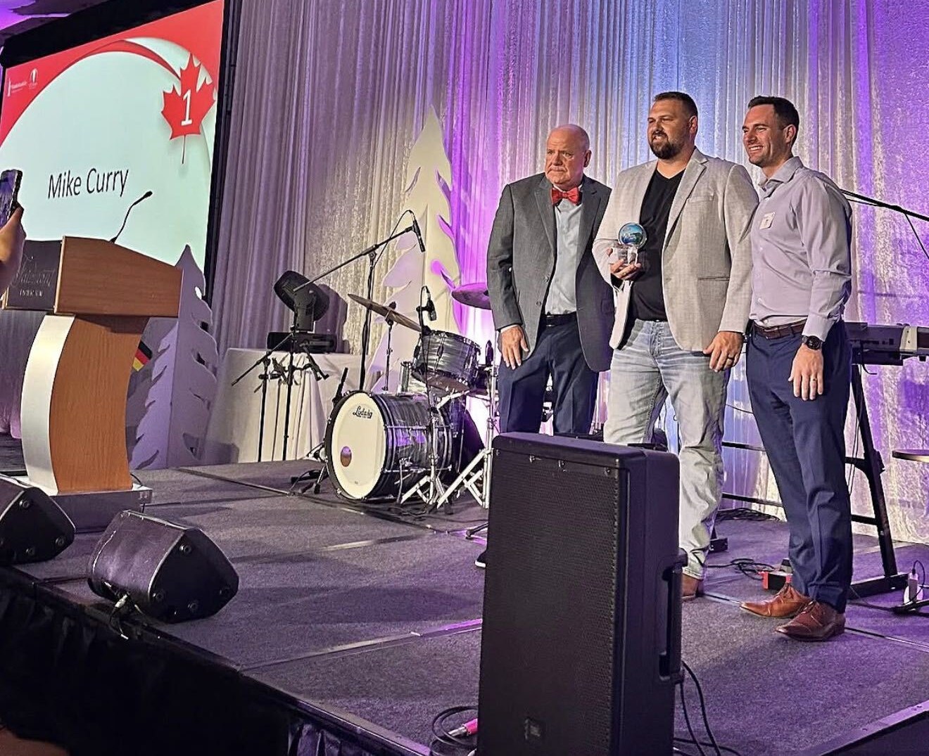Mike Curry accepting the #1 Agency award on stage at the Manhattan Life awards