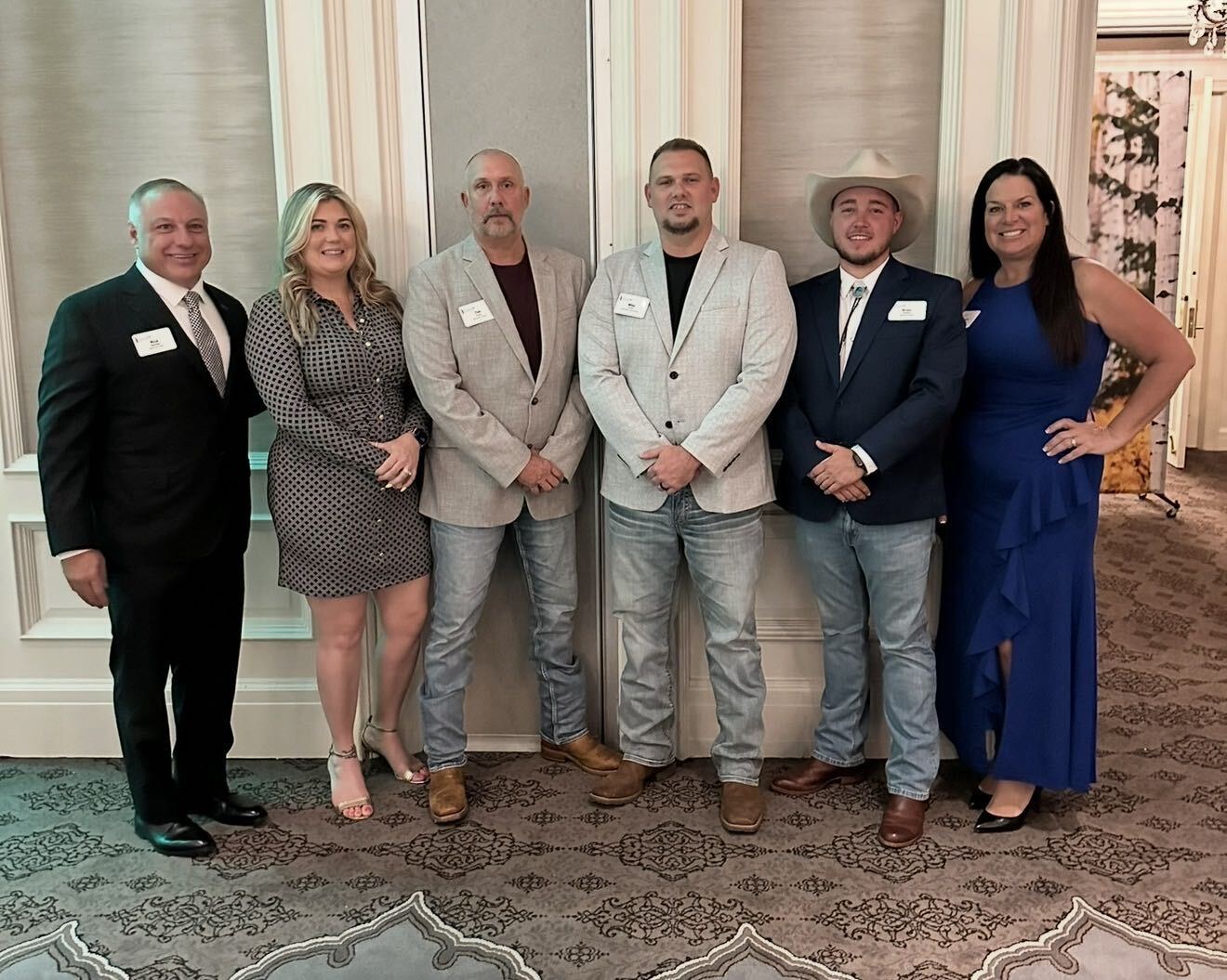 AO Financial and USA Benefits Group leaders at an industry event