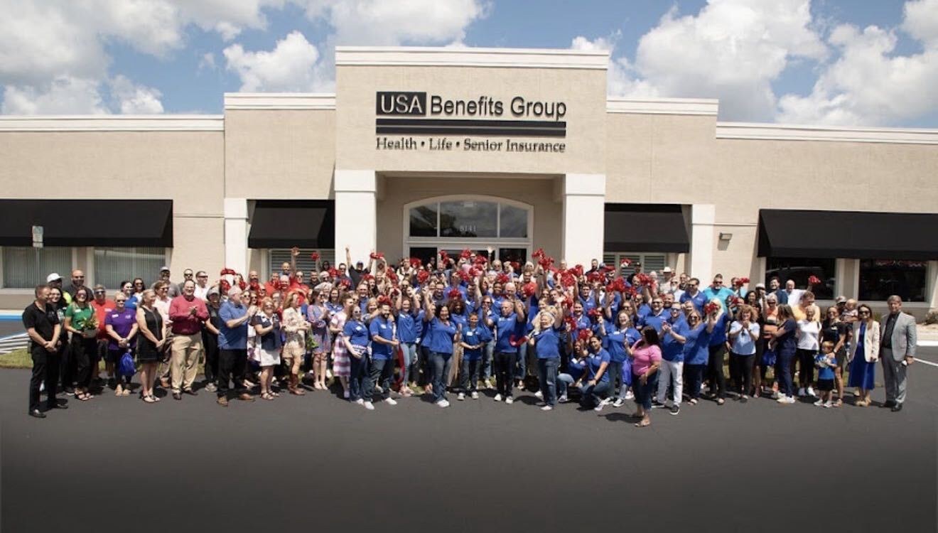 USA Benefits Group agents and staff gathered outside the USA Benefits Group office